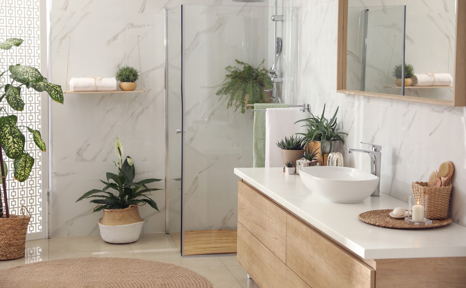 Stylish bathroom interior with countertop, shower stall and hous