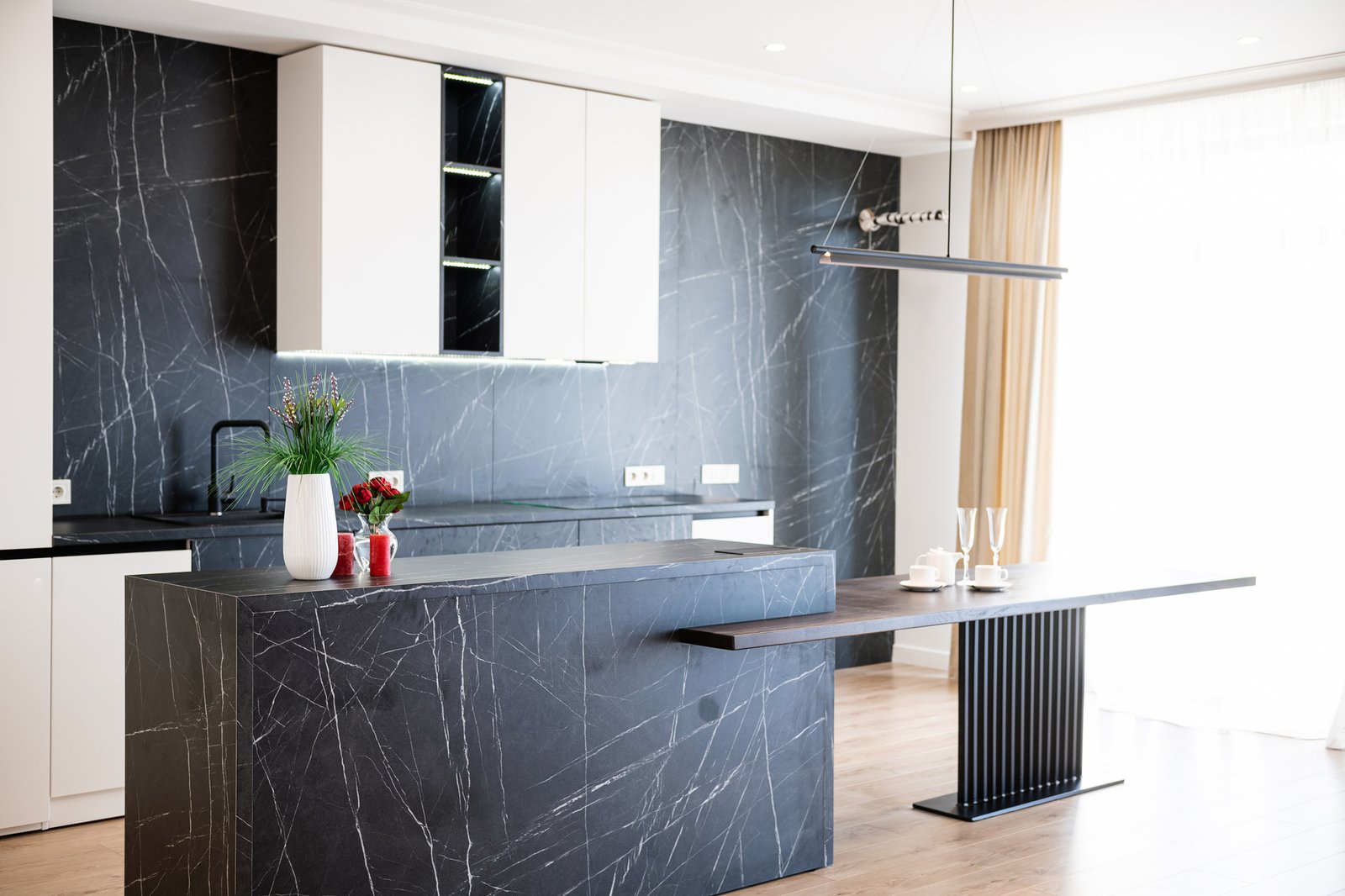 interior design of a new kitchen with dark and light furniture